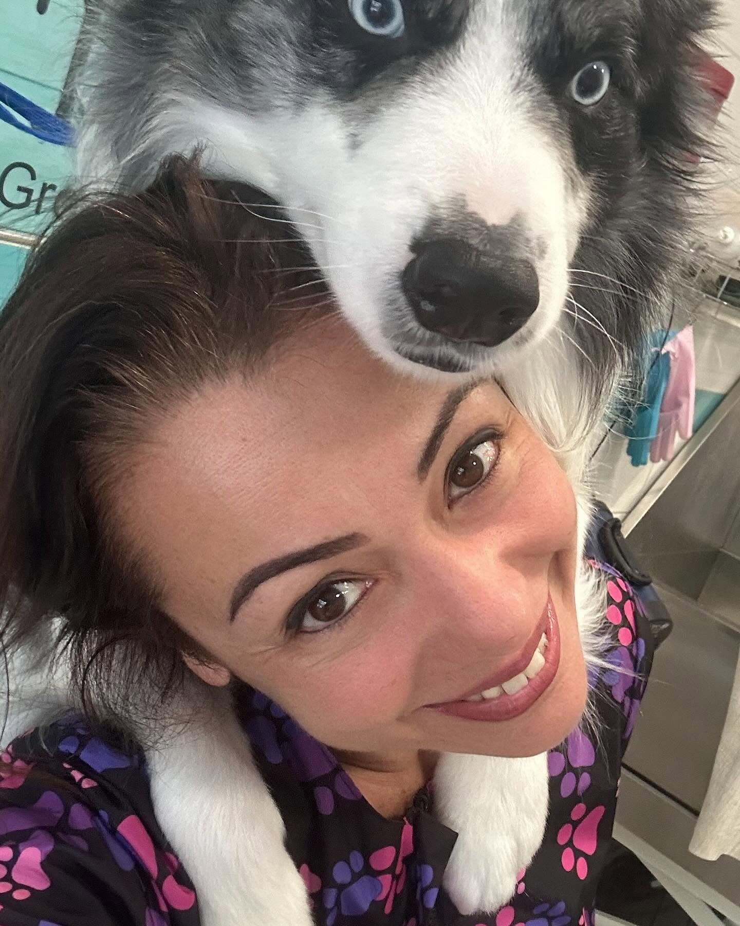 Francesca cuddling a border collie